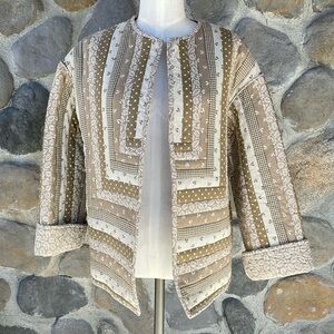 Quilted jacket sewn in neutral tan, white floral patterns cottagecore medium